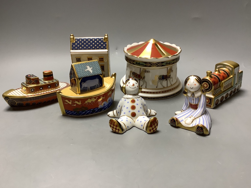 A Royal Crown Derby Treasures of Childhood Carousel money box and six other Royal Crown Derby models and paperweights